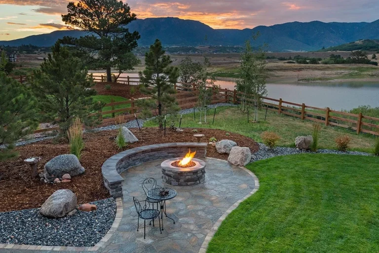 Cottage landscaping with mountain view sunset & lake