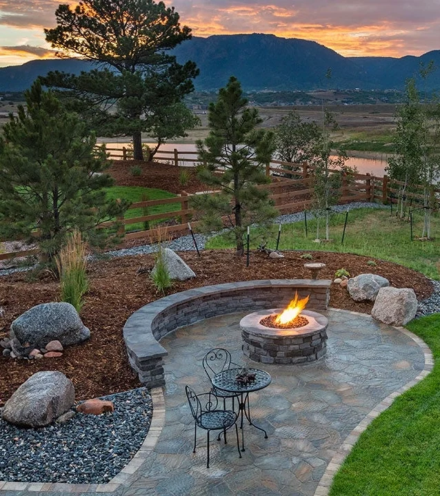 Cottage landscaping with mountain view sunset & lake